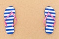 Colorful flipflop pair on beach sand Royalty Free Stock Photo