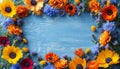 A colorful floral arrangement on a blue background, featuring a mix of sunflowers, roses, and wildflowers Royalty Free Stock Photo