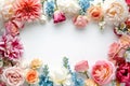 Colorful floral arrangement frame on white background, copy space for text in center Royalty Free Stock Photo