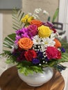 A colorful flower arrangement with spring and fall colors