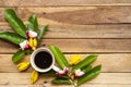 Colorful flower frangipani ,yellow flowers ylang ylang and leaf in spring season with hot coffee espresso Royalty Free Stock Photo