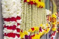 Colorful flower garlands are sold near the temple Royalty Free Stock Photo