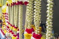 Colorful flower garlands are sold near the temple for traditional ceremonies Royalty Free Stock Photo