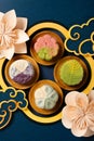 colorful flower shape snowy mooncakes with Chinese decorations at vertical composition Royalty Free Stock Photo