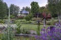 Colorful flowerbeds during the evening twilight in this beautifully landscaped garden with a great diversity of trees and flowerin