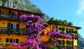 Colorful flowers decorating old houses, Limone sul Garda, Lake Garda, Italy. Limone sul Garda, regione Lombardia, Italy