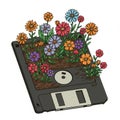 Colorful Flowers Growing From Old Floppy Disk Royalty Free Stock Photo