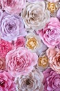 Colorful flowers paper background. Red, pink, purple, brown, yellow and peach handmade paper roses Royalty Free Stock Photo