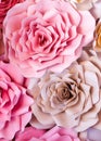 Colorful flowers paper background. Red, pink, purple, brown, yellow and peach handmade paper roses Royalty Free Stock Photo