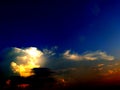 Colorful fluffy clouds in blue sky. blue sky with clouds and sun reflection.The sun shines bright in Royalty Free Stock Photo