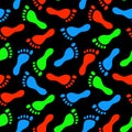 Colorful fluorescent human footprints on black seamless pattern, vector