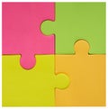 Colorful fluorescent puzzle pieces put together. Close-up, abstract background.Square Image