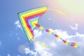 Colorful flying kite flying in the sky with clouds Royalty Free Stock Photo