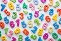 Colorful foam numbers scattered on white background, education concept Royalty Free Stock Photo