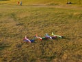 Colorful foam toy airplanes lie in a row on the grass.