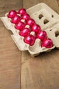 Colorful foiled eggs in container