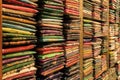 Colorful folded fabric sitting on a shelf in Little India Royalty Free Stock Photo