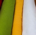 Colorful folded textile and fabric texturs in a close up view