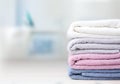 Colorful folded towels stack on table empty space. Royalty Free Stock Photo
