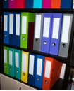 Colorful folders on the shelves in the office Royalty Free Stock Photo