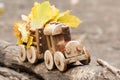 Colorful foliage background and a toy train. Fall October or November Royalty Free Stock Photo