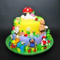 Colorful fondant cake with animals figurines Royalty Free Stock Photo