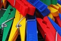 Colorful forecaps tweezers clips as background. Clothespin clothes pin colorful clothespeg red yellow blue clothes peg