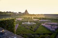 Colorful formal garden at sunset, with a mysterious light