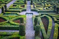 Colorful formal garden at sunset, with a mysterious light