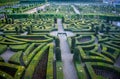 Colorful formal garden at sunset, with a mysterious light