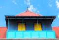 Colorful house with balcony against blue sky. Centre De La Ville De Victoria Seychelles
