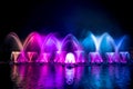 The colorful fountain dancing in celebration of year with dark night sky background. Royalty Free Stock Photo