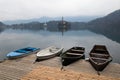 Colorful four wooden rowing boats in wonderful scenic island with church on pure lake bled