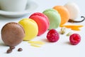 Colorful french macarons abstract still life with fruits and ingredients on white background Royalty Free Stock Photo