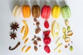 Colorful french macarons abstract still life with fruits and ingredients on white background Royalty Free Stock Photo