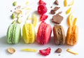 Colorful french macarons abstract still life with fruits and ingredients on white background Royalty Free Stock Photo