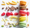 Colorful french macarons abstract still life with fruits and ingredients on white background Royalty Free Stock Photo