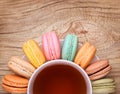 Colorful French Macarons with Cup of Tea Royalty Free Stock Photo