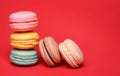 Colorful French Macarons over red