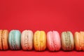 Colorful French Macarons over red