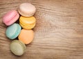 Colorful French Macarons on wood background