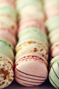 Colorful french macaroons flat lay. Pastel colors pink, green, yellow macarons with copy space, top view. Holidays and Royalty Free Stock Photo