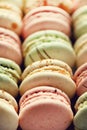 Colorful french macaroons flat lay. Pastel colors pink, green, yellow macarons with copy space, top view. Holidays and Royalty Free Stock Photo