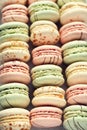 Colorful french macaroons flat lay. Pastel colors pink, green, yellow macarons with copy space, top view. Holidays and Royalty Free Stock Photo