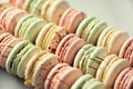 Colorful french macaroons flat lay. Pastel colors pink, green, yellow macarons with copy space, top view. Holidays and Royalty Free Stock Photo