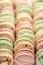 Colorful french macaroons flat lay. Pastel colors pink, green, yellow macarons with copy space, top view. Holidays and Royalty Free Stock Photo