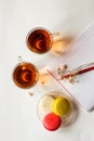 Colorful french macaroons with two cups of tea on the white flat lay Royalty Free Stock Photo