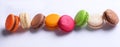 Colorful french macaroons on white background. Almond cookies.Top view, flat lay. Valentine`s day sweet gift concept,holiday,