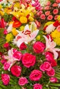 Colorful fresh blossoming flowers, beautiful lily, roses and other flowers at the florist shop shelves on footpath, Phsa Thmei