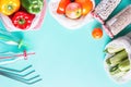 Colorful fresh fruits and vegetables in reusable cotton bags on blue background. Zero waste or responsible food shopping and Royalty Free Stock Photo